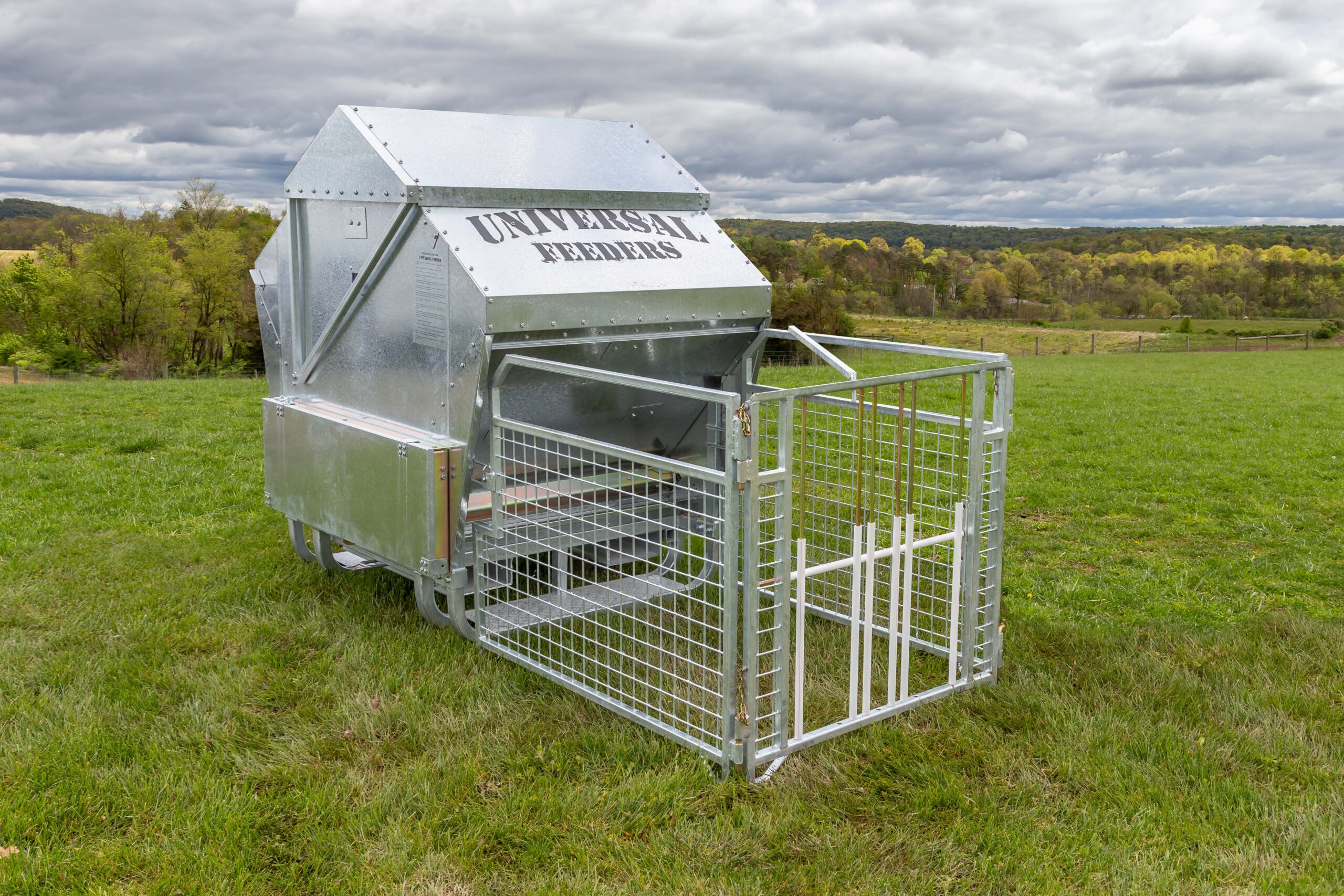1250L Universal Feeder fitted with lamb creep gate kit in a paddock